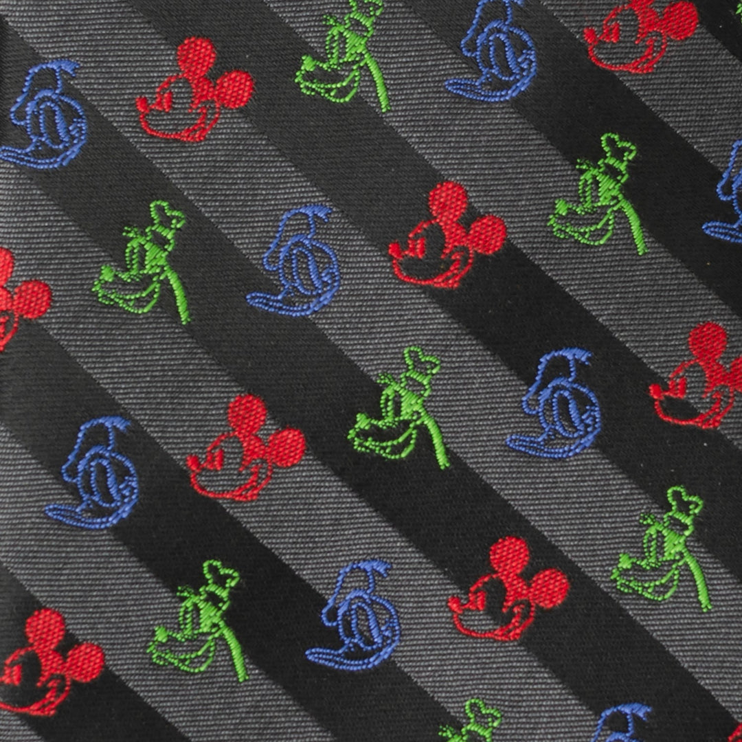 Disney Mickey and Friends Multi Black Stripe Men’s Tie featuring black and gray diagonal stripes with embroidered red Mickey Mouse heads and green and blue Goofy silhouettes.