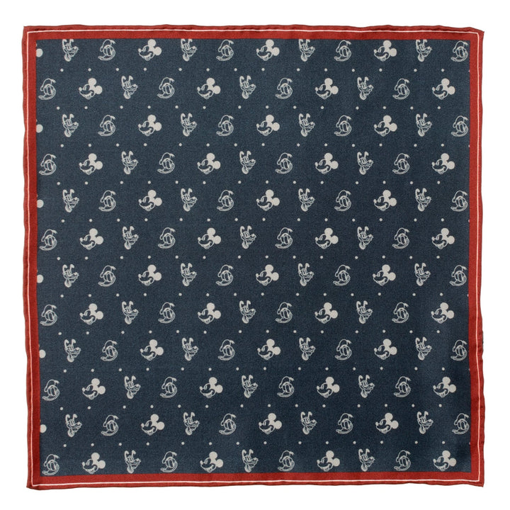 Disney Mickey and Friends Pocket Square in navy blue silk with a white polka dot and Mickey Mouse head pattern, framed by a red border.