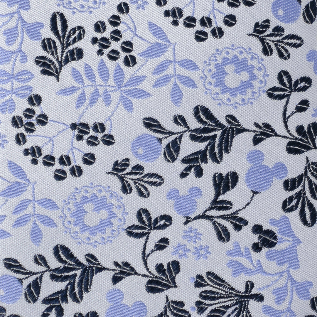 Disney Mickey Mouse Floral Silhouette Blue and White Tie made of white fabric with a repeating blue and dark grey floral pattern featuring hidden Mickey silhouettes.