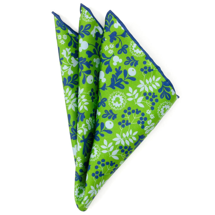 Disney Mickey Mouse Floral Green Pocket Square, shown folded in a triangle with a bright green silk fabric and a blue floral pattern featuring hidden Mickey Mouse silhouettes.
