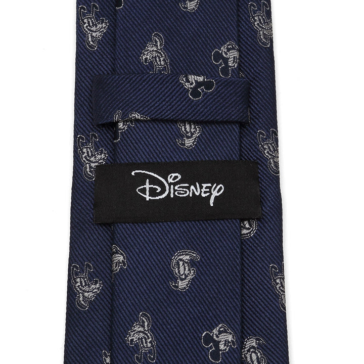Cufflinks.com Disney Mickey and Friends Blue Men’s Tie in dark blue 100% silk with small gray Mickey Mouse head icons and a black Disney label on the back.