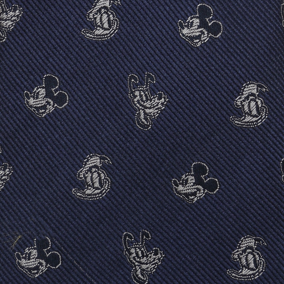 A dark blue 100% silk Disney Mickey and Friends Blue Men’s Tie featuring a repeating pattern of Mickey Mouse and Pluto silhouettes in silver thread.