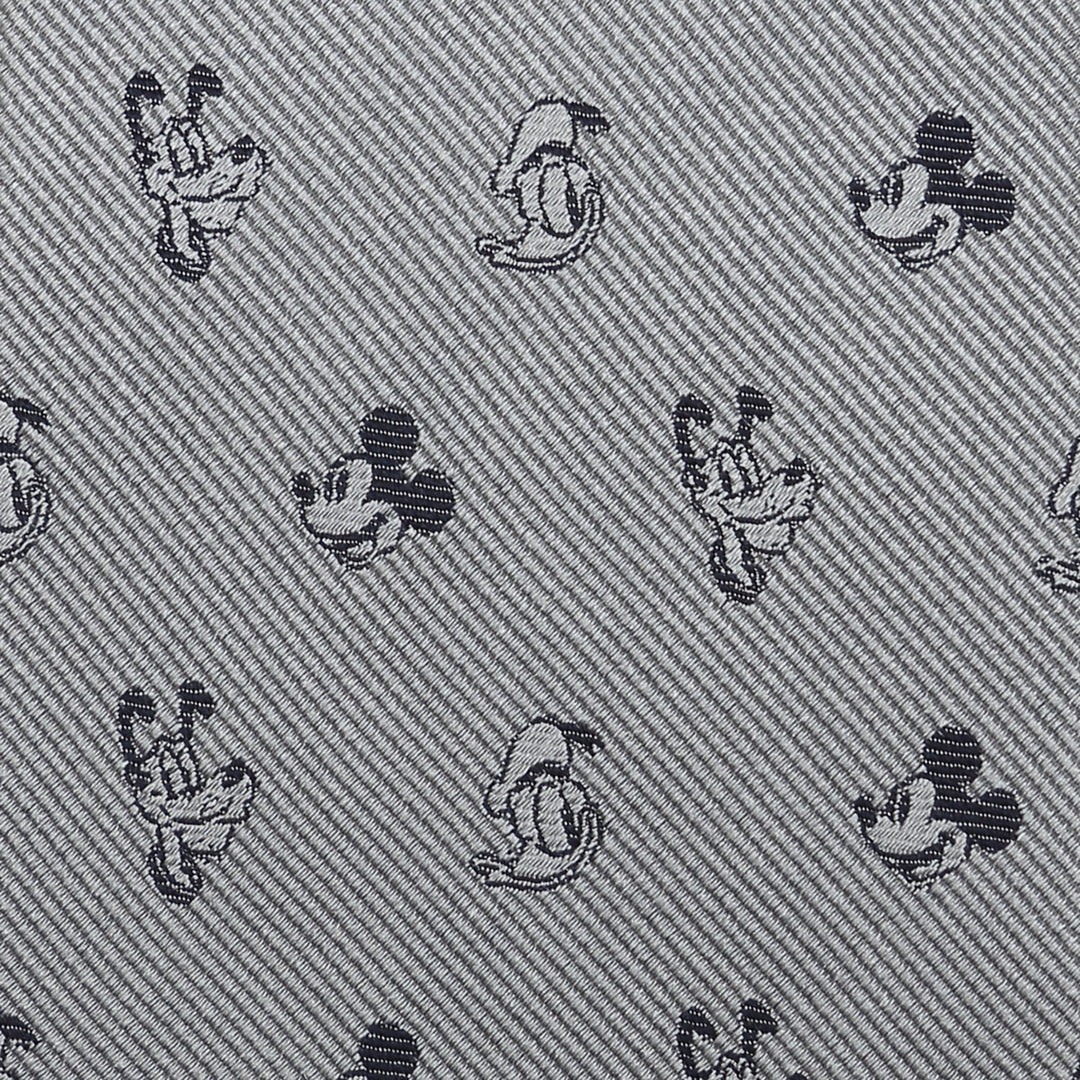 Disney Mickey and Friends Gray Men’s Tie in 100% silk with a repeating diagonal pattern of small black Mickey and Pluto heads.