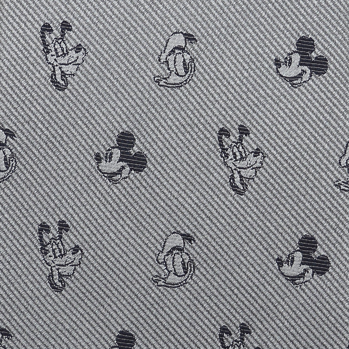 Disney Mickey and Friends Gray Men’s Tie in 100% silk with a repeating diagonal pattern of small black Mickey and Pluto heads.