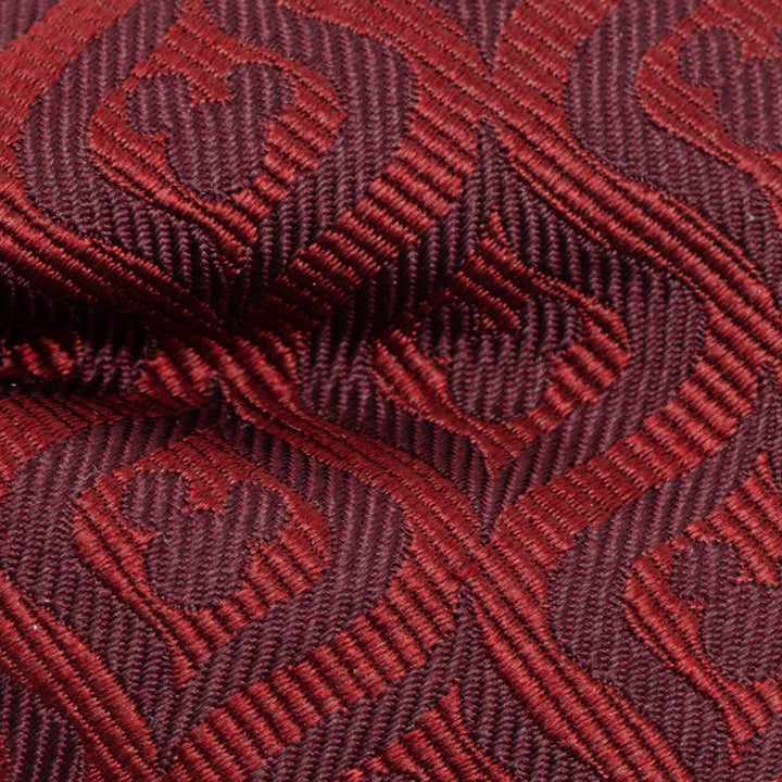Disney Mickey Mouse Holiday Maroon Bow Tie made of maroon fabric with a repeating woven pattern of Mickey Mouse silhouettes.