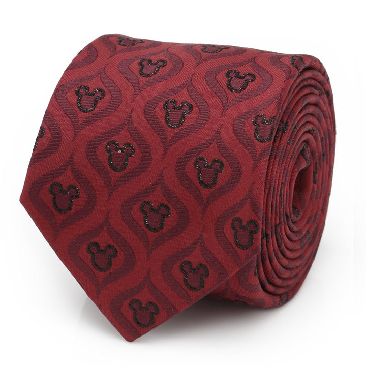 Rolled burgundy Disney Mickey Mouse Holiday Metallic Black Silk Men’s Tie featuring a repeating pattern of dark silhouettes within wavy shapes.