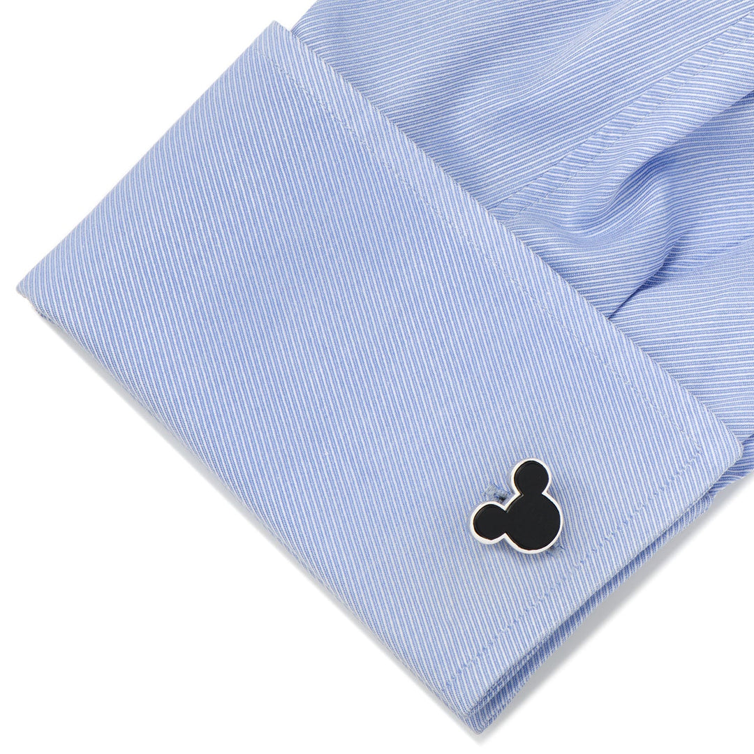 Disney Mickey Mouse Sterling Silver and Onyx Cufflinks shaped like a silhouette attached to a light blue dress shirt cuff.