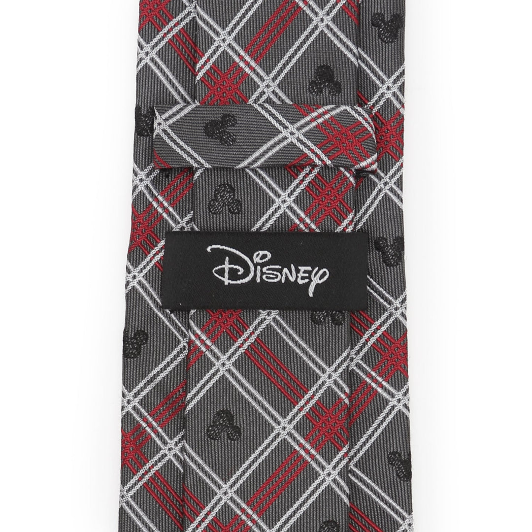 Disney Mickey Mouse Holiday Gray Plaid Silk Men’s Tie in gray and red plaid, featuring small black silhouettes and a Disney logo tag on the back.
