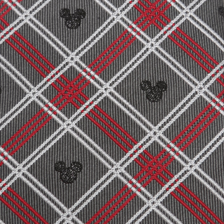 Disney Mickey Mouse Holiday Gray Plaid Silk Men’s Tie in gray with a red and white plaid pattern featuring small black Mickey Mouse head icons.