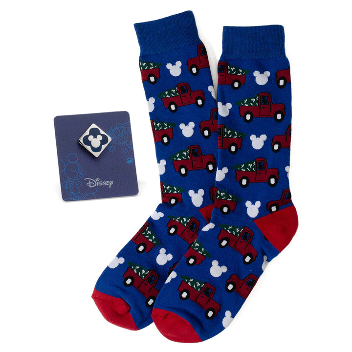 Disney Mickey Mouse Holiday Truck Navy Socks and Blue Lapel Pin Gift Set featuring blue socks with red pickup trucks and white Mickey Mouse icons, accompanied by a matching lapel pin.