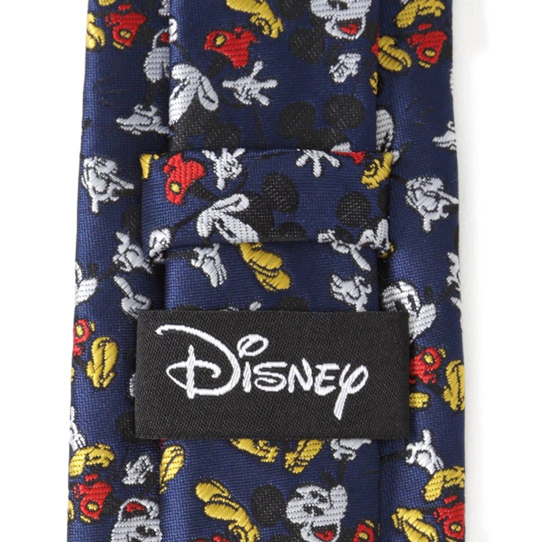 Disney Mickey Mouse Action Navy Men’s Tie in navy blue with a pattern of small character figures and a black Cufflinks.com brand label on the back.