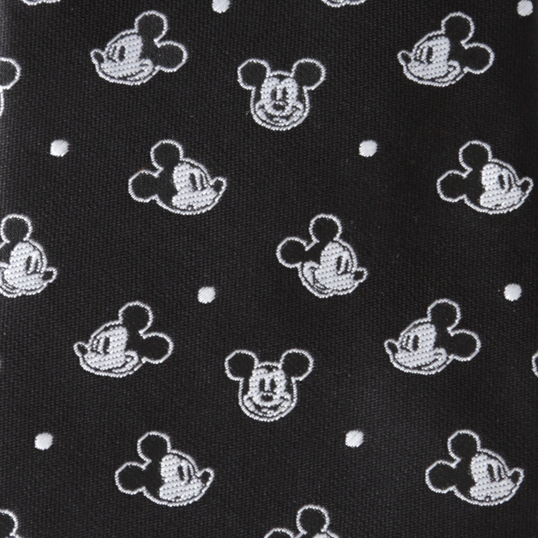 Disney Mickey Mouse Black Dot Men’s Tie in black, patterned with white character heads and small dots.
