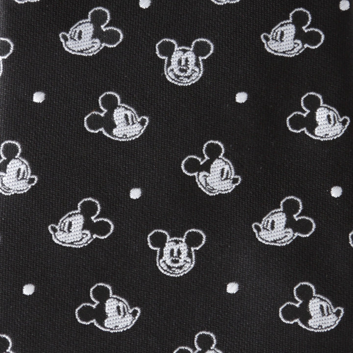 Disney Mickey Mouse Black Dot Men’s Tie in black, patterned with white character heads and small dots.