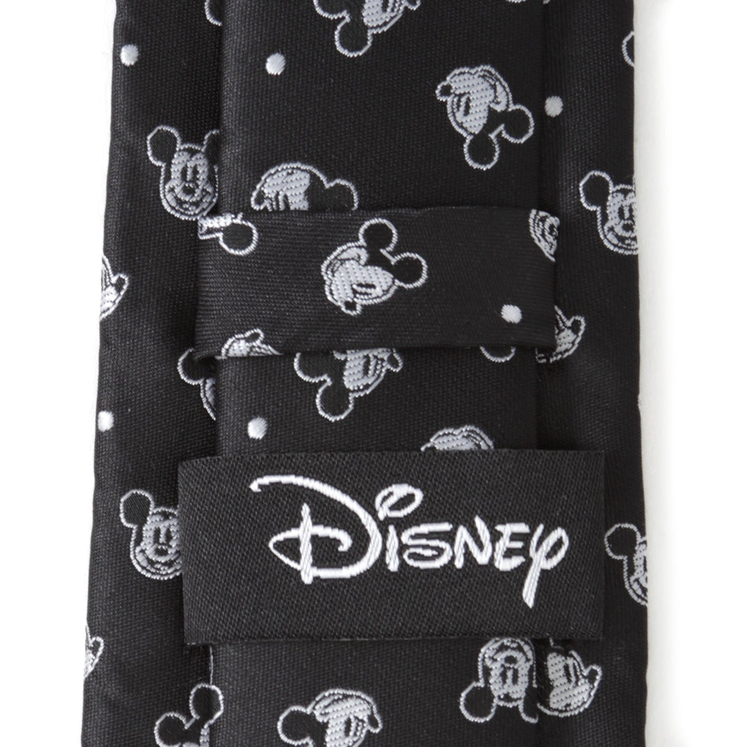 Disney Mickey Mouse Black Dot Men’s Tie in black 100% polyester with a repeating pattern of white silhouettes and small dots, featuring a brand label on the back.