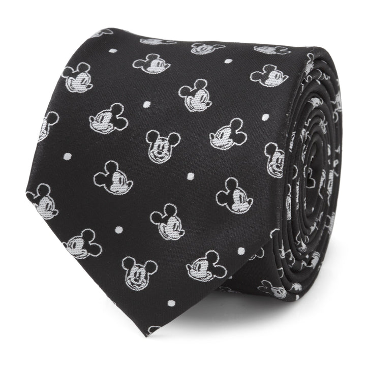 Disney Mickey Mouse Black Dot Men’s Tie, a rolled black tie with a repeating pattern of white character heads and small dots.