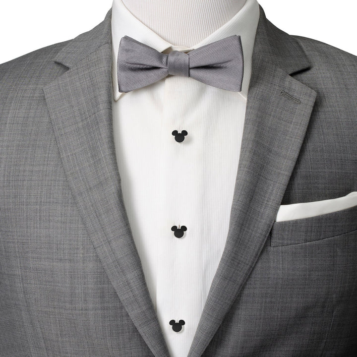 A gray suit jacket and white shirt featuring a Disney Mickey Mouse Silhouette 5-Stud Set and a gray bow tie.