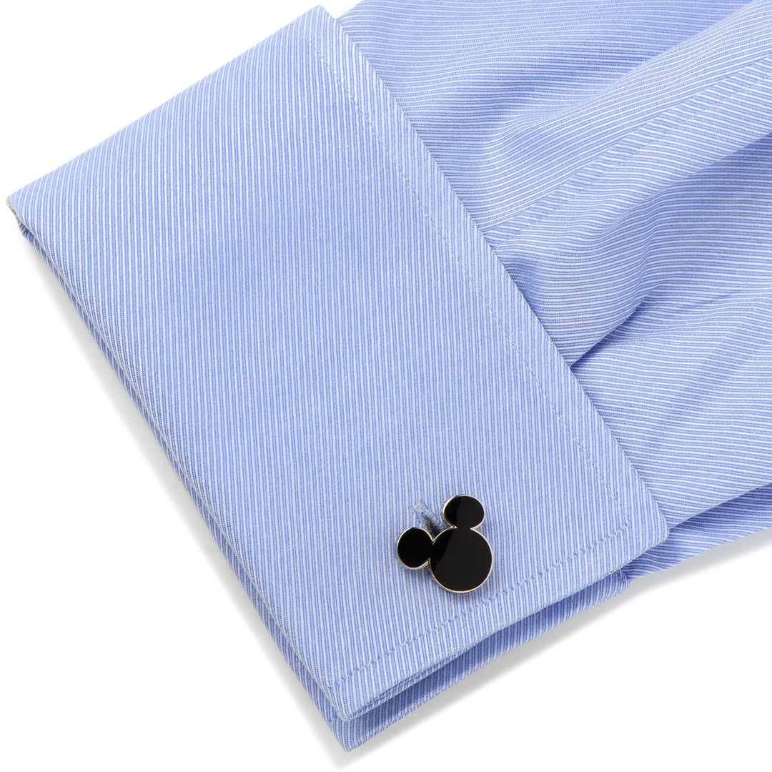 Black Disney Mickey Mouse Silhouette 5-Stud Set cufflink attached to a blue pinstriped French cuff.