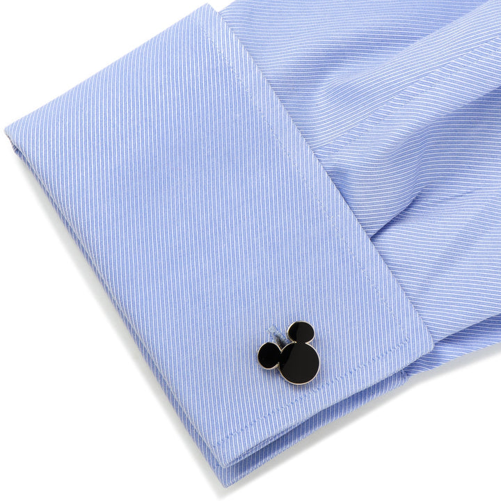 Black Disney Mickey Mouse Silhouette 5-Stud Set cufflink attached to a blue pinstriped French cuff.