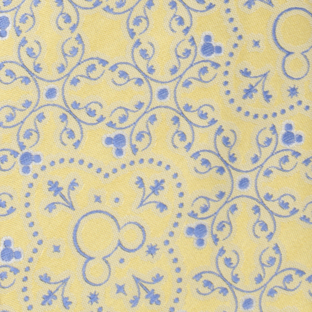 Disney Mickey Mouse Yellow Multi Men’s Tie in yellow with blue ornamental swirls and small Mickey Mouse head silhouettes.
