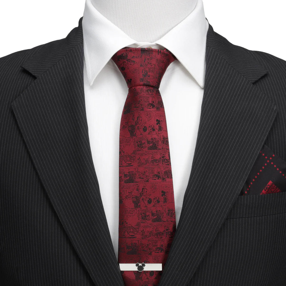 Disney Mickey Mouse Comic Red Men’s Tie in silk with a black comic strip print, worn with a white shirt, a pinstripe suit jacket, and a silver Mickey Mouse tie bar.