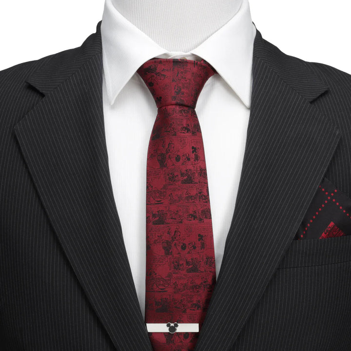 Disney Mickey Mouse Comic Red Men’s Tie in silk with a black comic strip print, worn with a white shirt, a pinstripe suit jacket, and a silver Mickey Mouse tie bar.