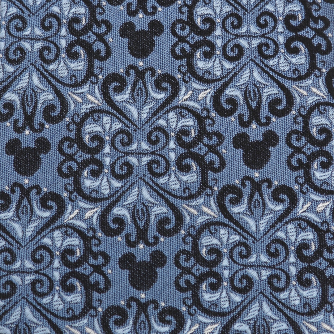 Disney Mickey Mouse Damask Tile Blue Men’s Tie made of blue silk fabric with a repeating black and blue damask pattern featuring integrated Mickey Mouse silhouettes.