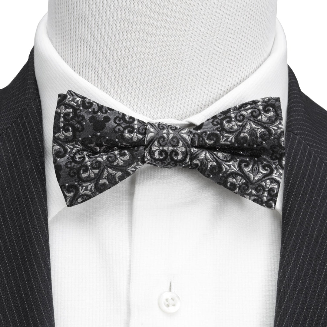 Disney Mickey Mouse Damask Pocket Square and Bow Tie Gift Set featuring a black and gray damask bow tie worn with a white dress shirt and dark suit jacket.