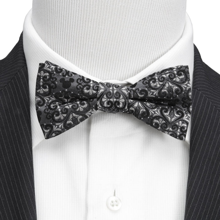 Disney Mickey Mouse Damask Pocket Square and Bow Tie Gift Set featuring a black and gray damask bow tie worn with a white dress shirt and dark suit jacket.