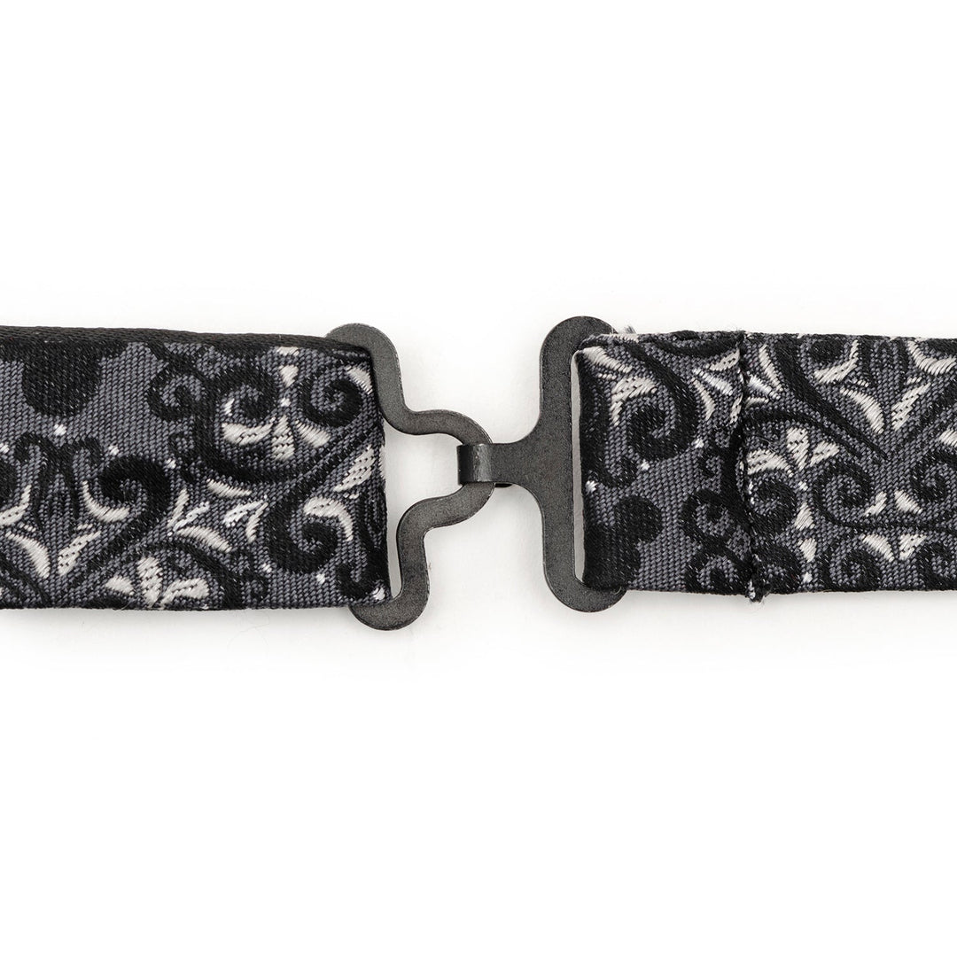 A black metal hook-and-eye closure on a black and gray damask Mickey Mouse bow tie from the Disney Mickey Mouse Damask Pocket Square and Bow Tie Gift Set, featuring hidden silhouettes.