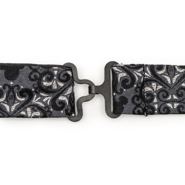 A black metal hook-and-eye closure on a black and gray damask Mickey Mouse bow tie from the Disney Mickey Mouse Damask Pocket Square and Bow Tie Gift Set, featuring hidden silhouettes.