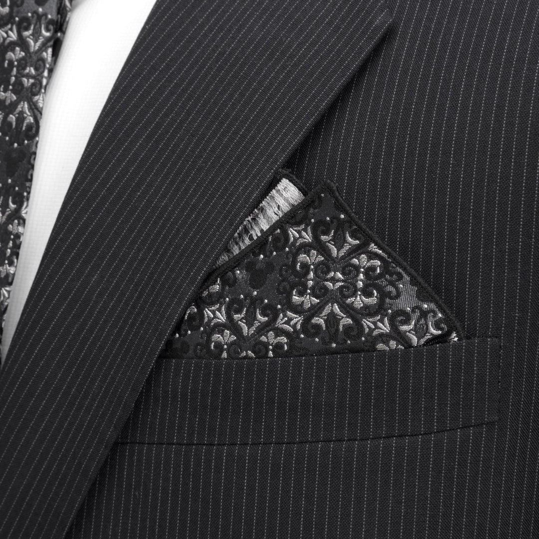 Disney Mickey Mouse Damask Tile Pocket Square in black and grey, tucked into the breast pocket of a pinstriped suit jacket.