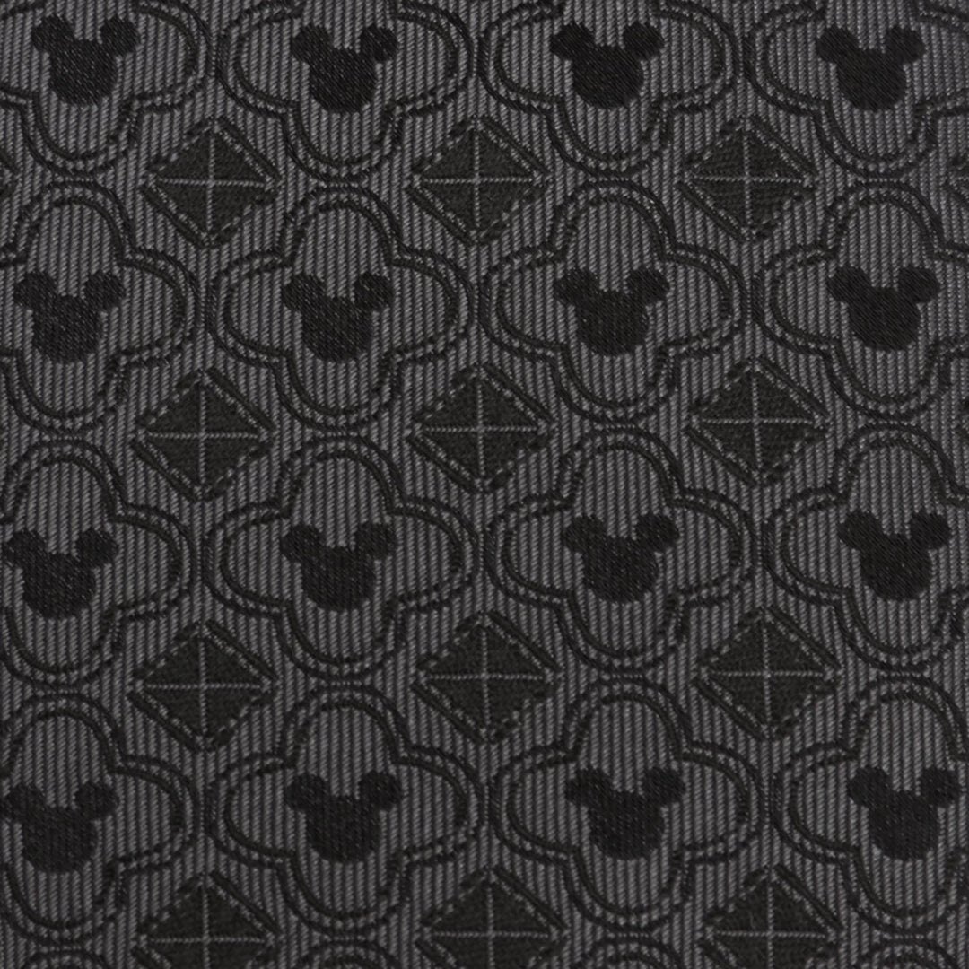 Disney Mickey Mouse Pattern Black Men’s Tie in black silk featuring a repeating dark grey pattern of Mickey Mouse silhouettes inside quatrefoil shapes and small squares.