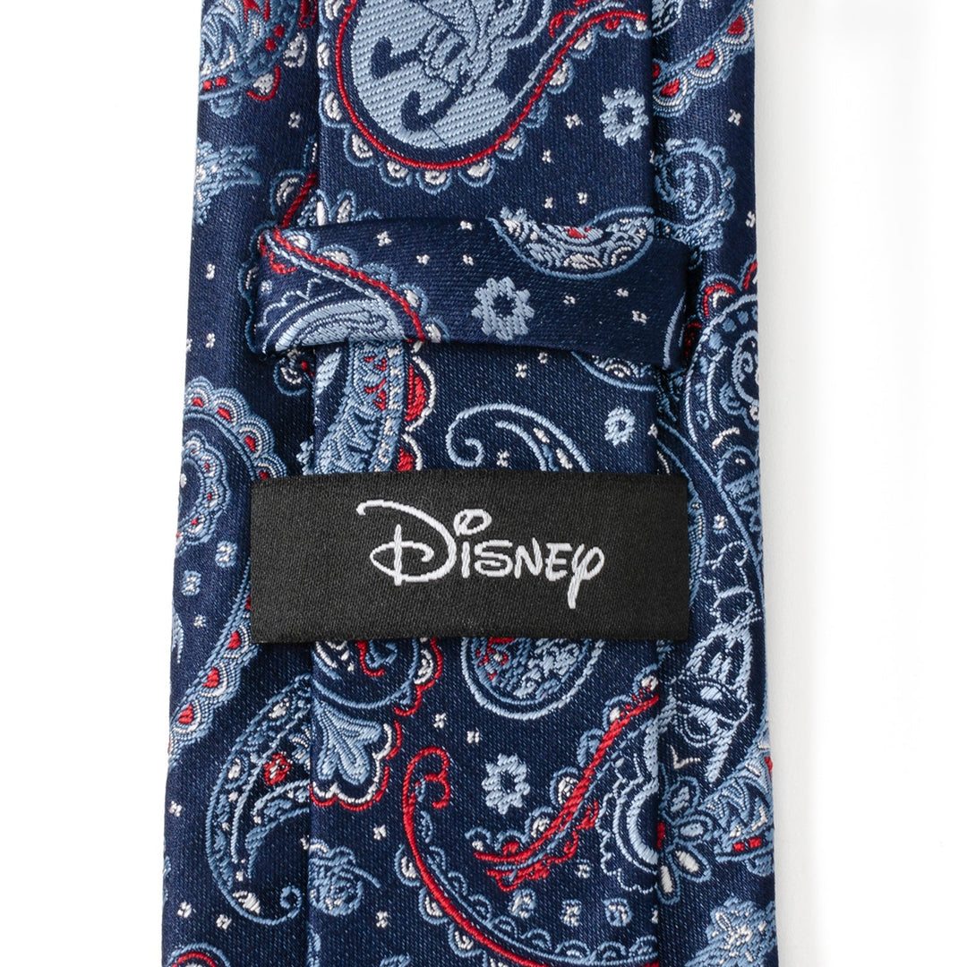 Disney Mickey and Friends Paisley Blue Multi Men’s Tie in blue featuring a red and light blue paisley pattern with Mickey Mouse silhouettes and a black “Disney” label on the back.