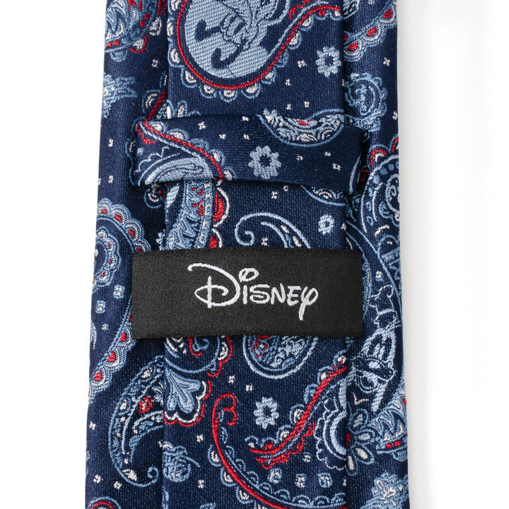 Disney Mickey and Friends Paisley Blue Multi Men’s Tie in blue featuring a red and light blue paisley pattern with Mickey Mouse silhouettes and a black “Disney” label on the back.