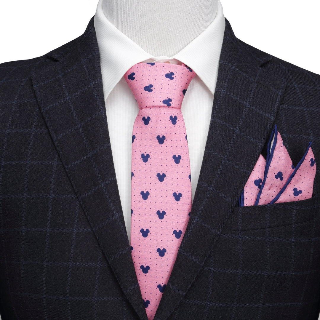 Disney Mickey Mouse Dot Pink Tie and Pocket Square Gift Set with a navy blue silhouette pattern, worn with a white dress shirt and dark plaid suit jacket.