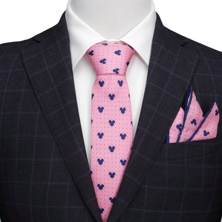 Disney Mickey Mouse Dot Pink Tie and Pocket Square Gift Set with a navy blue silhouette pattern, worn with a white dress shirt and dark plaid suit jacket.