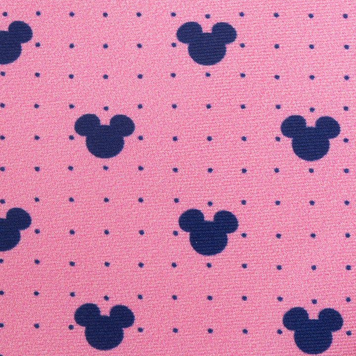 Disney Mickey Mouse Dot Pink Men’s Tie in pink silk with a repeating pattern of small blue polka dots and dark blue Mickey Mouse silhouettes.
