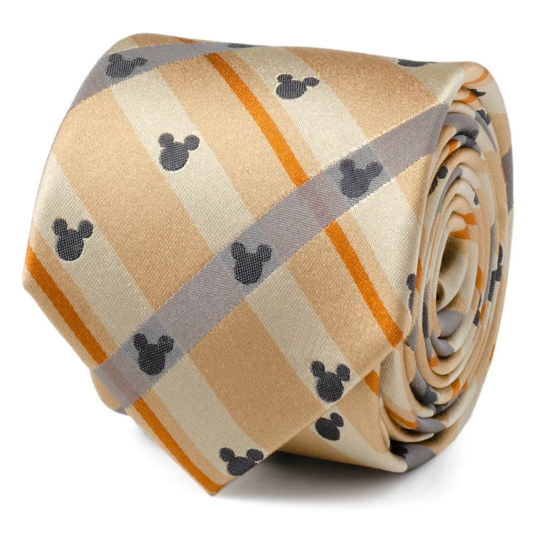 A Disney Mickey Mouse Silhouette Tan Plaid Tie in tan, orange, and gray silk, rolled into a coil.