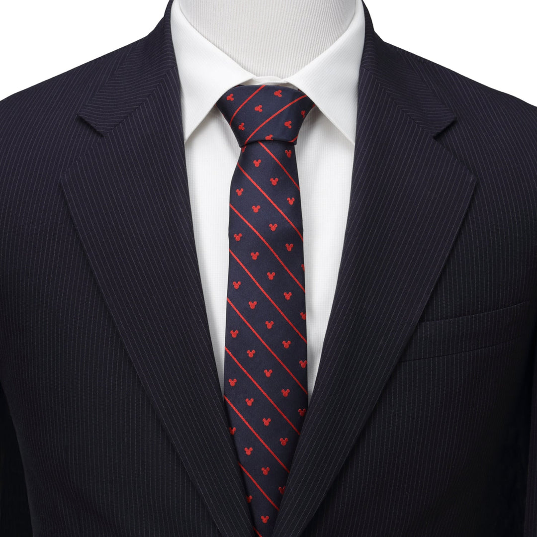 A Disney Mickey Mouse Navy Pinstripe Tie featuring red diagonal stripes, worn with a white dress shirt and a navy pinstripe suit jacket.