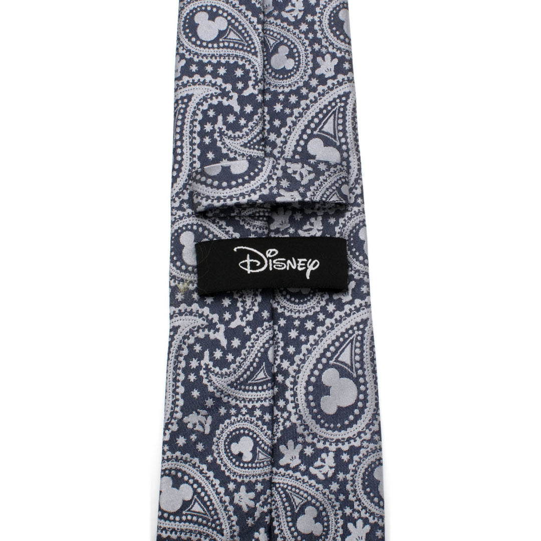 Disney Mickey Mouse Gray Paisley Mens Tie in gray silk with a repeating white paisley and Mickey Mouse head pattern, featuring a black Disney logo label on the back.