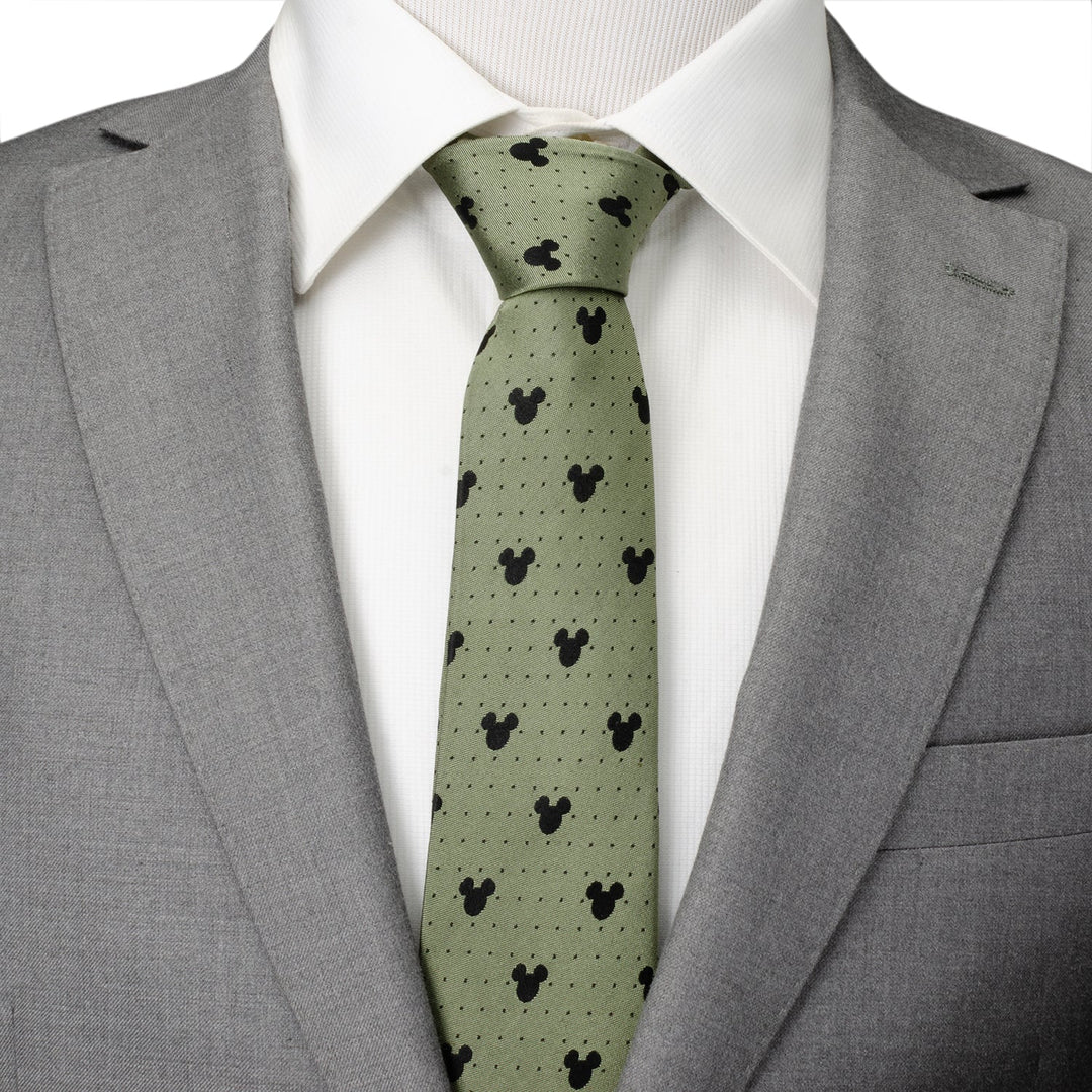 Disney Mickey Mouse Silhouette Dot Green Men’s Tie in light green silk with a black silhouette and dot pattern, worn with a white dress shirt and grey suit jacket.