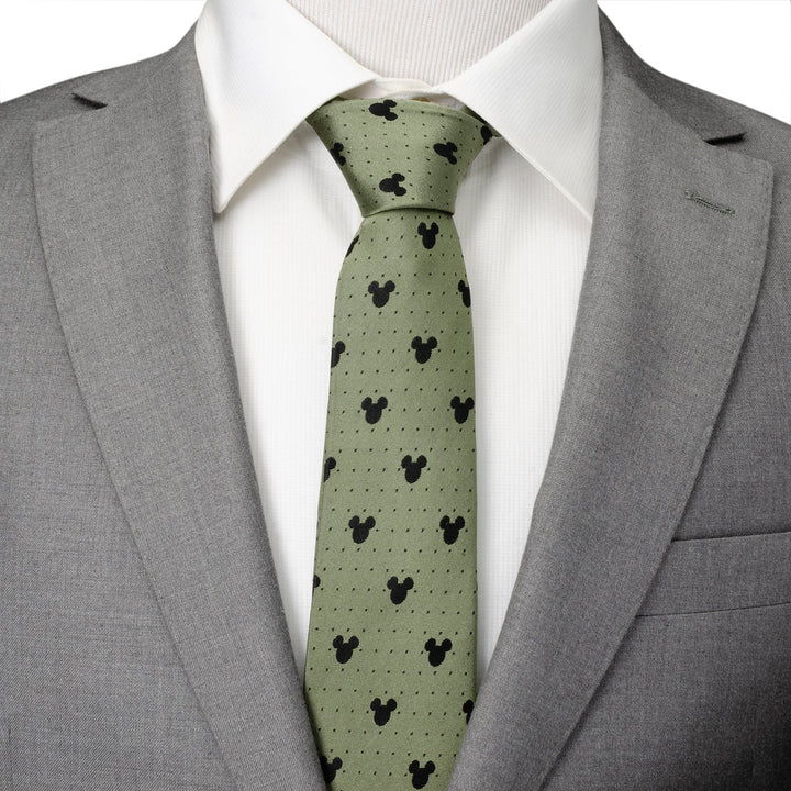 Disney Mickey Mouse Silhouette Dot Green Men’s Tie in light green silk with a black silhouette and dot pattern, worn with a white dress shirt and grey suit jacket.
