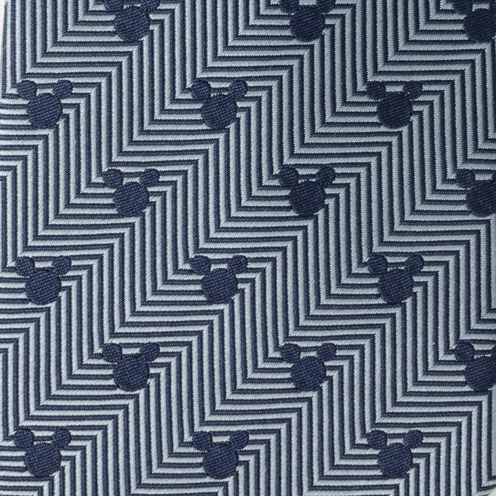Disney Mickey Mouse Silhouette Blue Herringbone Men’s Tie in blue and grey herringbone with a geometric pattern featuring small dark Mickey Mouse silhouette icons.