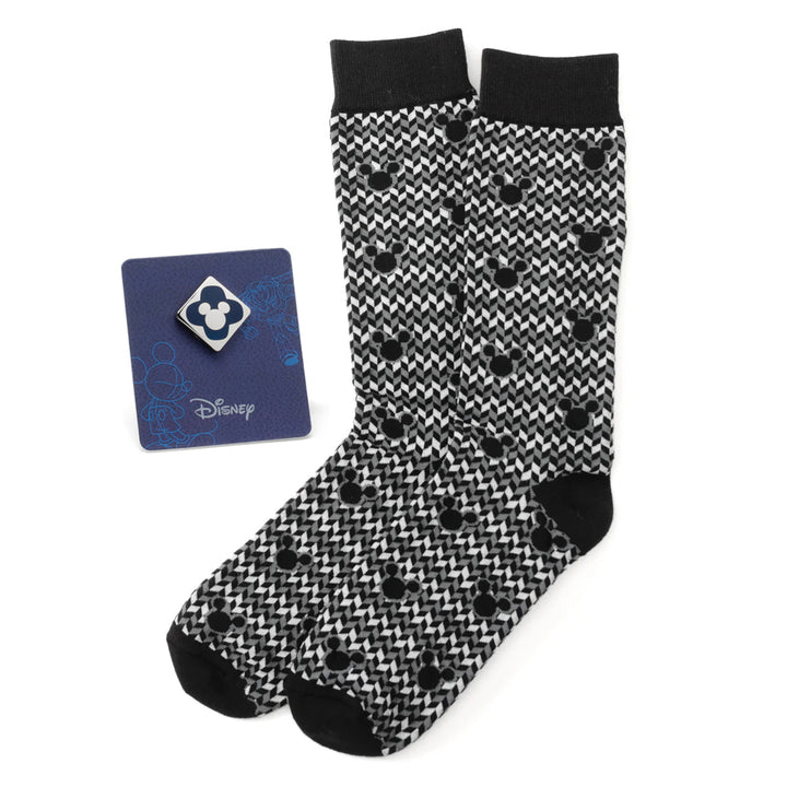 A Disney Mickey Mouse Silhouette Chevron Sock and Mickey Blue Lapel Pin Gift Set featuring black and white silhouette socks and a blue Mickey lapel pin on a display card.