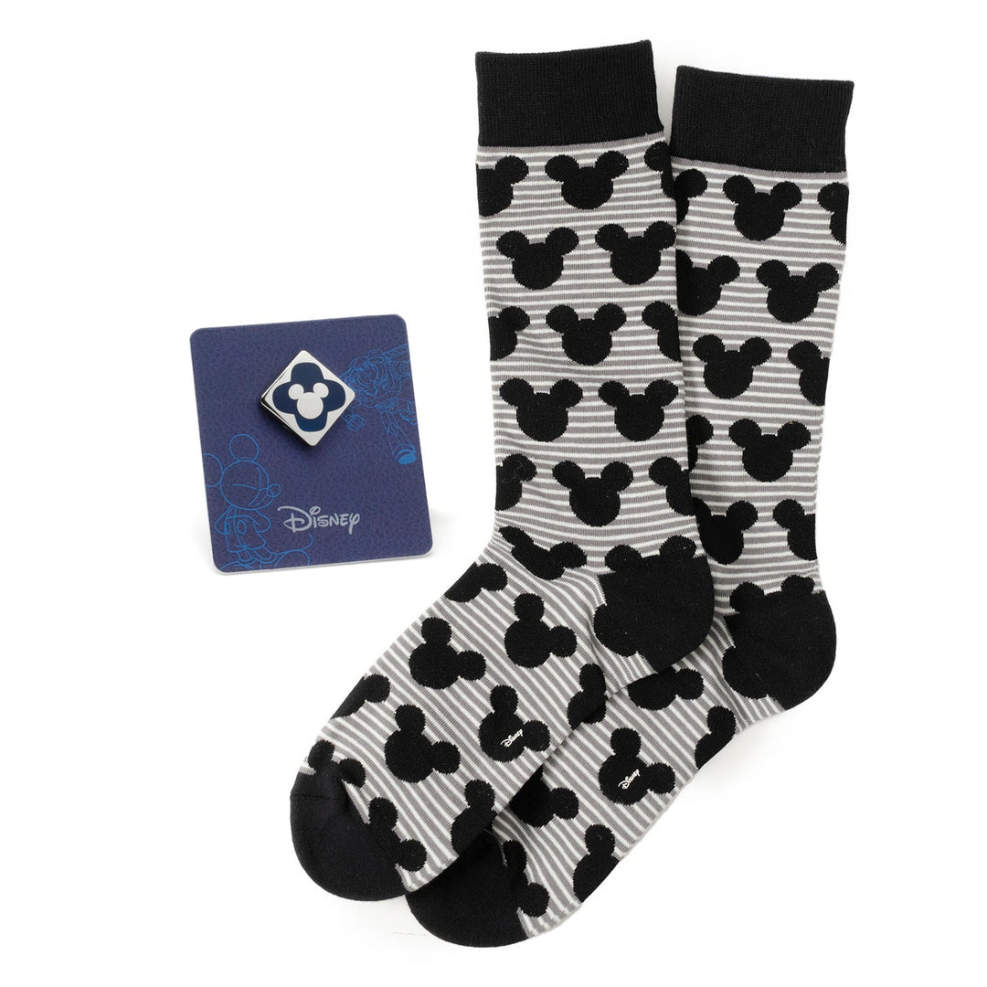 Disney Mickey Mouse Stripe Gray Sock and Mickey Blue Lapel Pin Gift Set featuring gray and black striped socks with a Mickey head pattern and a square blue and white Mickey lapel pin on a display card.