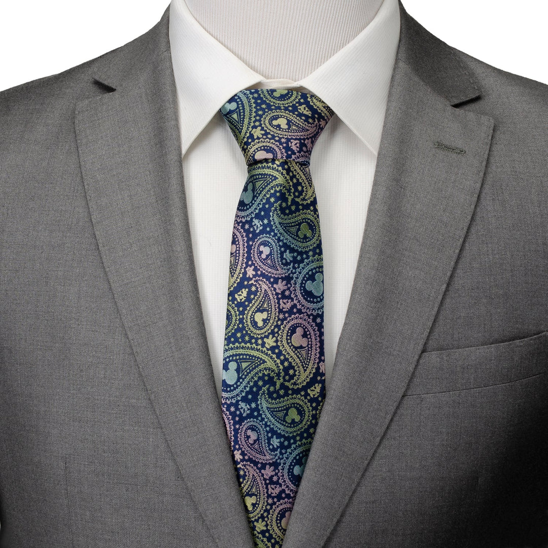 Disney Mickey Mouse Silhouette Iridescent Paisley Navy Tie in navy blue with subtle Mickey Mouse silhouettes, worn with a white shirt and gray suit jacket.