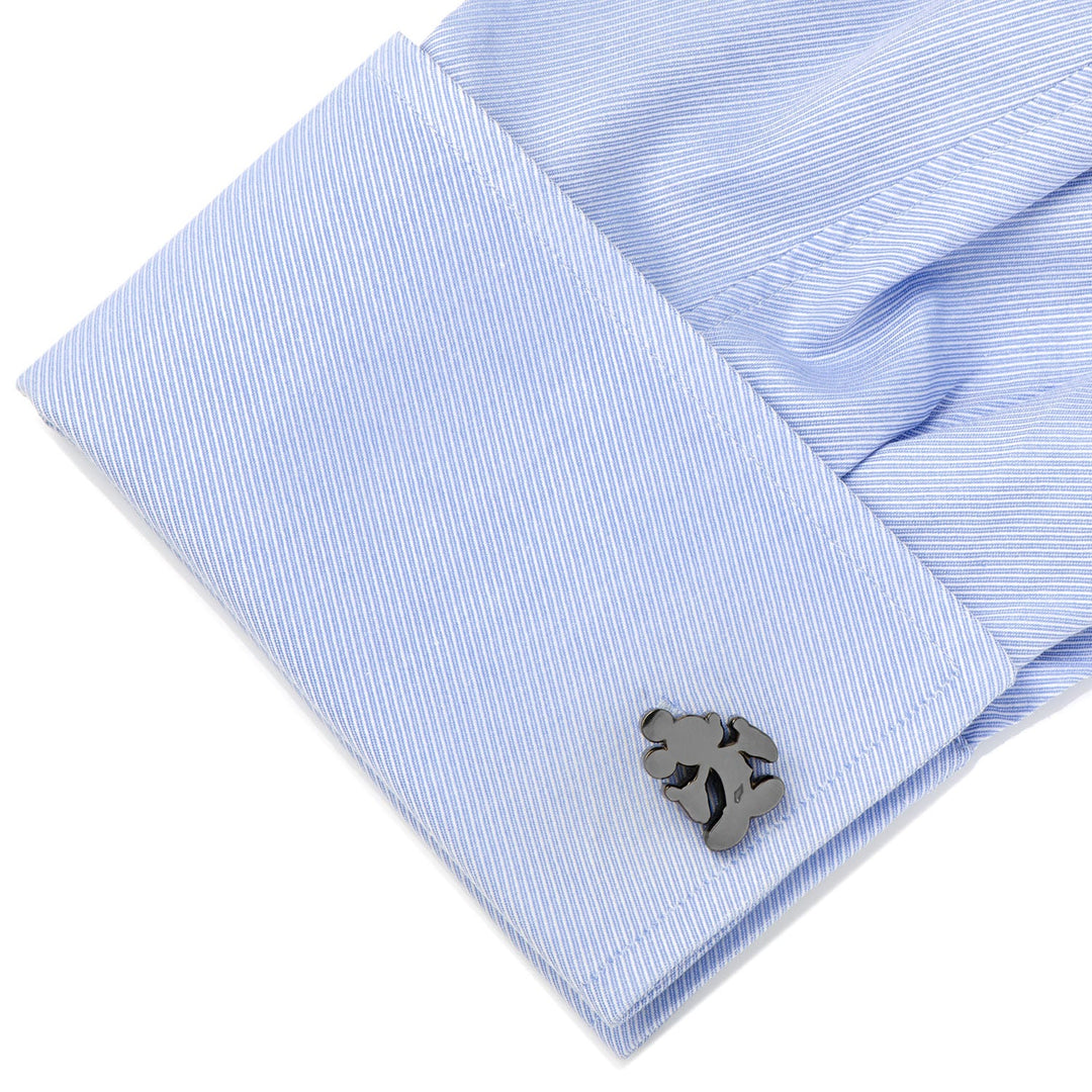 Dark metallic Disney Mickey Mouse Silhouette Cufflinks on a light blue, diagonal-striped French cuff shirt.