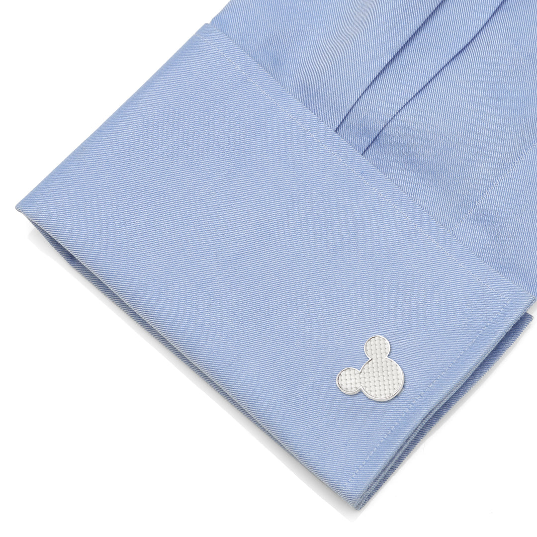 Disney Mickey Mouse Silhouette Basket Weave Cufflinks in silver-tone with a textured pattern, fastened to a light blue dress shirt cuff.