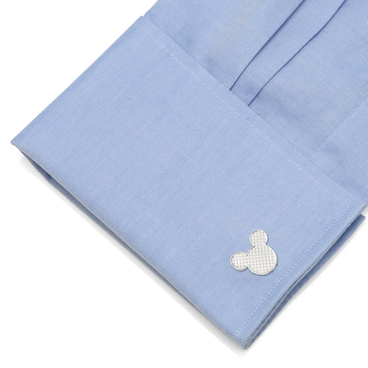 Disney Mickey Mouse Silhouette Basket Weave Cufflinks in silver-tone with a textured pattern, fastened to a light blue dress shirt cuff.