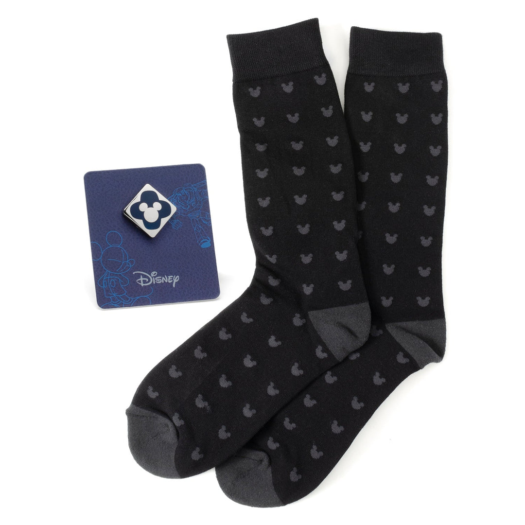 Disney Mickey Mouse Silhouette Motif Black Sock and Mickey Blue Lapel Pin Gift Set featuring black socks with a grey Mickey silhouette pattern and a blue Mickey lapel pin displayed on a Disney card.